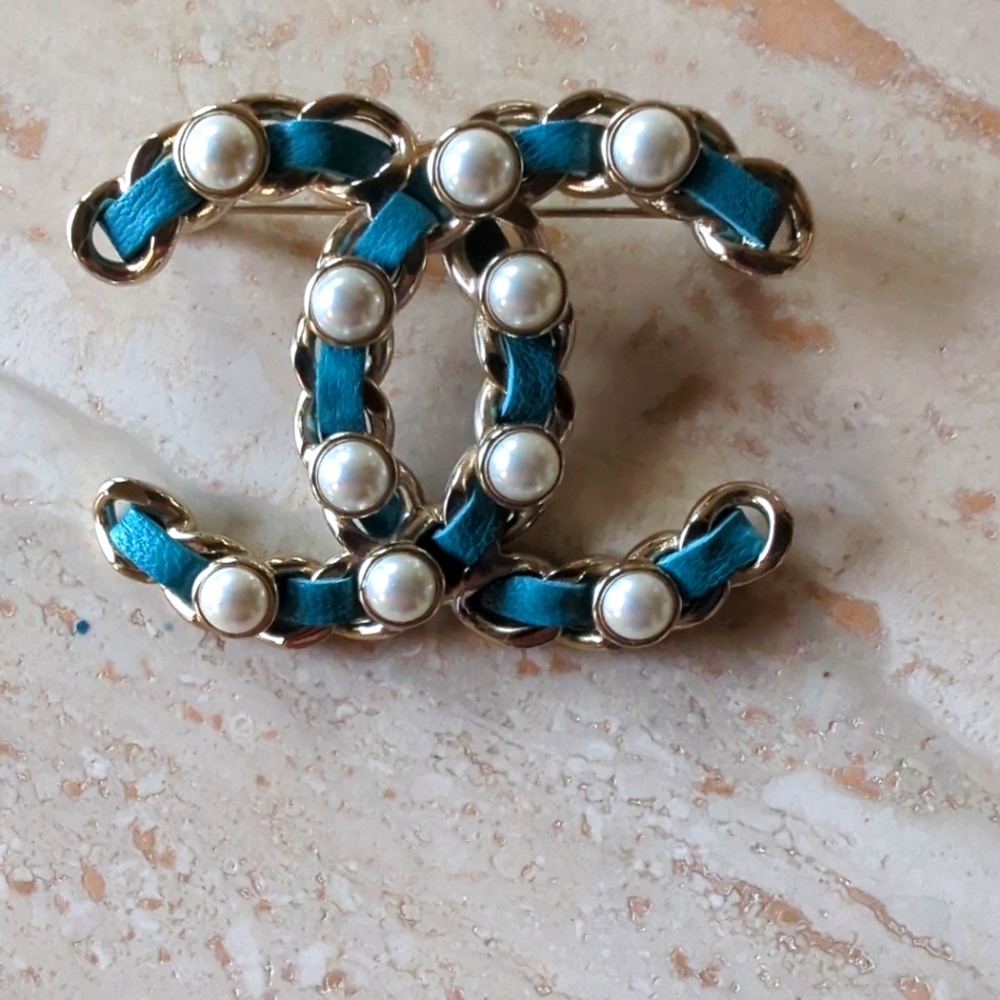 authentic ***CHANEL*** LEATHER AND PEARL BROOCH
